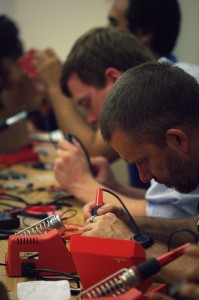 Soldering during Summer School 2013 kickoff kit-build